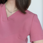 Detaliu decolteu si material stretch la bluza medicala Vera.
