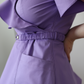 Detaliu feronerie premium și cordon elastic la bluza medicală Blooming Orchid, lucrată pe măsuri în atelier.